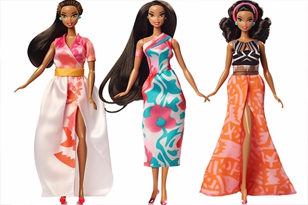 Image of Barbie dolls with Polynesian dresses